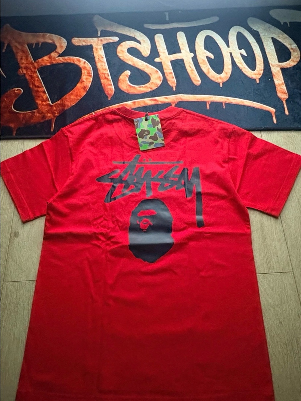 Stussy Red Tee with Black Graphic Logo